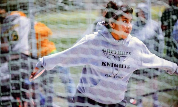 Headwind provides lift for Greyhills discus throwers