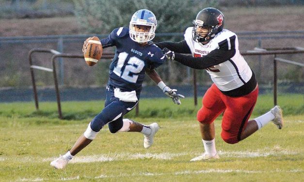 Page quarterback runs wild over Scouts