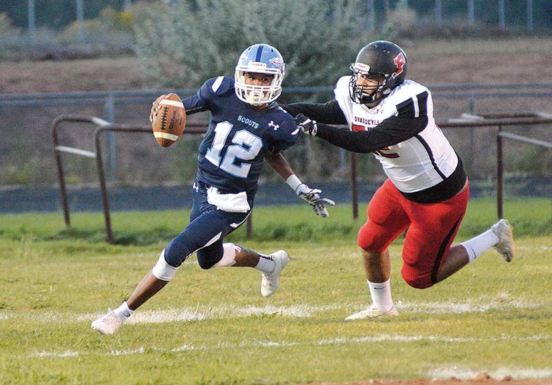 Page quarterback runs wild over Scouts