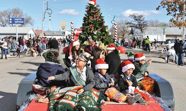 Snow grounds balloons, parade spreads holiday cheer