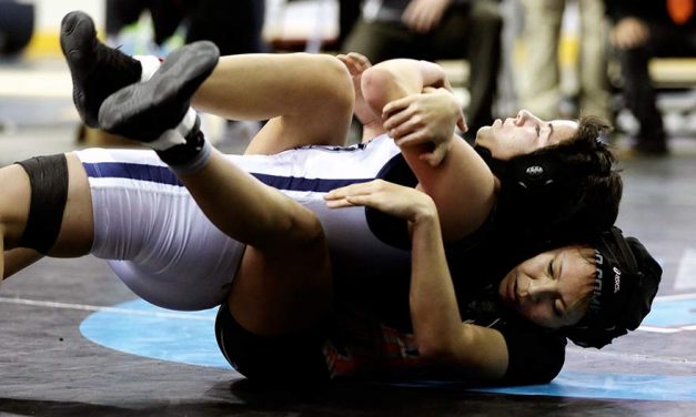 Wrestler overcomes injury, wins state girls’ title