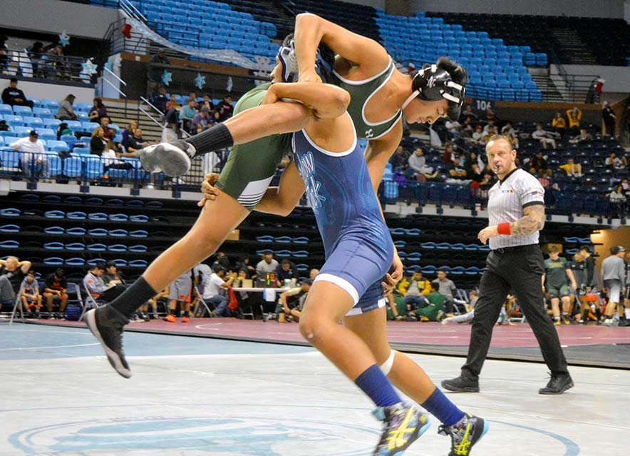 ‘It was like East meets West’:  Veterans Memorial tourney threw grapplers into the fire