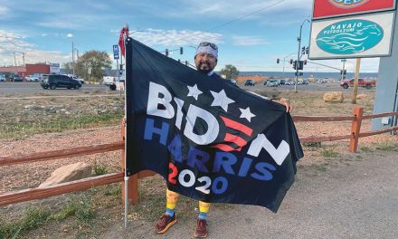 Runner carries flag for Biden-Harris