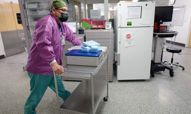 Scrub tech keeps fighting virus after losing loved ones