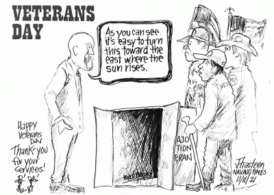 Veterans day. Official tells veters that a cardboard box used to house homeless veterans can be turned towards the east where the sun rises. Kyle Begay's name is written on the inside of the box.