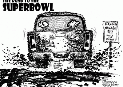 The Road to the Superbowl. Pickup truck headed over muddy road with Kansas City Chiefs and Philly Eagles logos in back window. Bumper sticker says Nygren for Prez. Sign says leaving Navajo Rez, watch for potholes. Sidekicks say Road to basketball finals.