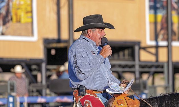 Longtime rodeo announcer Boyd Polhamus works up the crowd